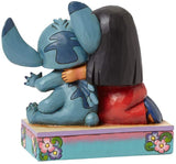 Lilo &#038; Stitch Ohana Disney Traditions Statue Measures Approximately 4.875-Inches Tall. Includes Original Enesco Box And Packaging. Ages 5 And Up.