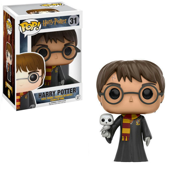 Harry Potter Funko Pop #31 vinyl figure in Hogwarts robes holding Hedwig